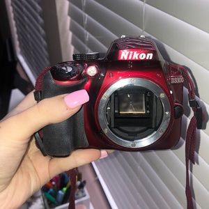 Red Nikon D3300 digital camera